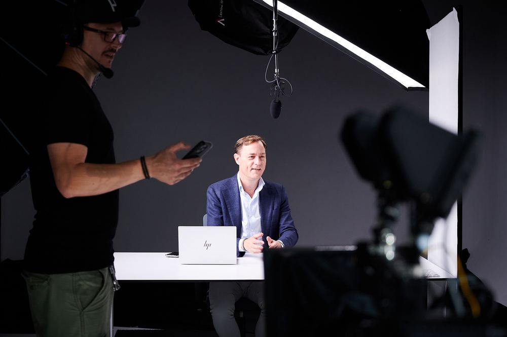 Interviewing on set at Hoi Studio, dialled-in lighting and teleprompter